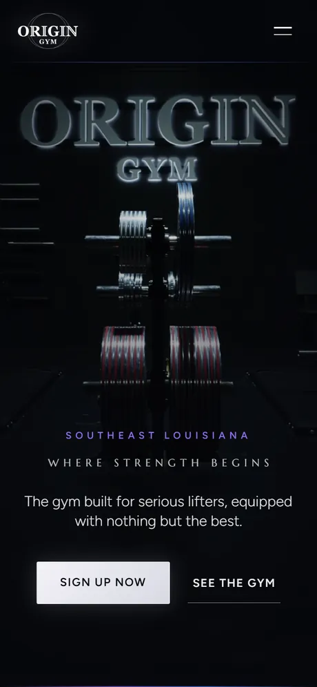 The rebuilt Origin Gym website on a phone screen, the lit sign filling the dark hero.